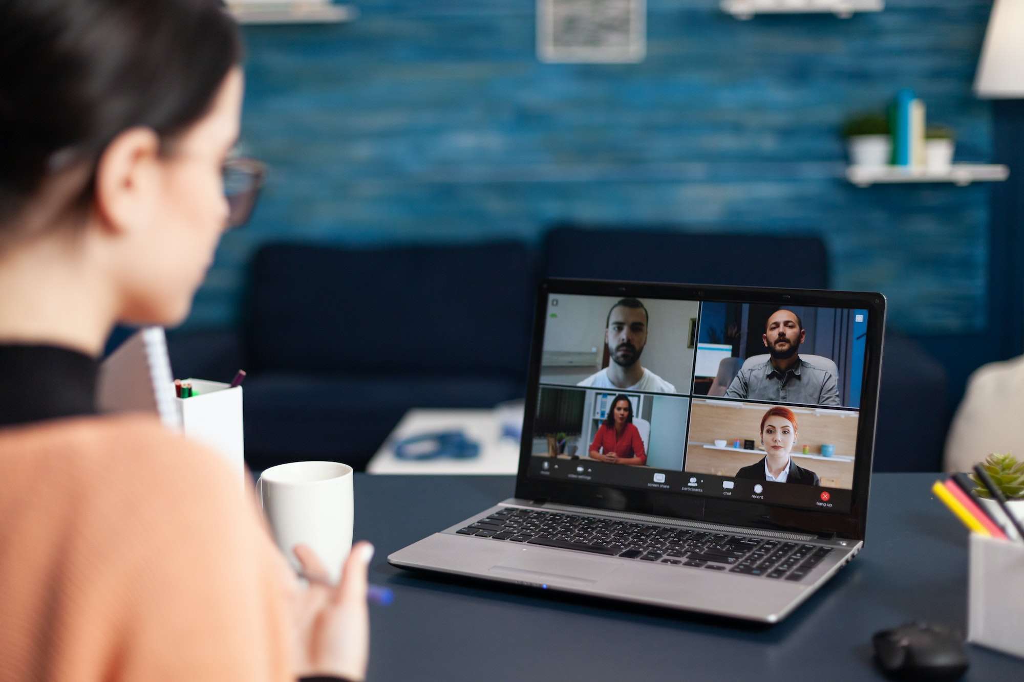 Freelancer having group online meeting on laptop
